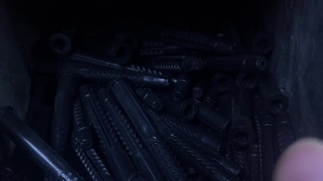 Dark blue plastic tubes stacked together in close up view. industrial material, manufacturing component, warehouse storage.
