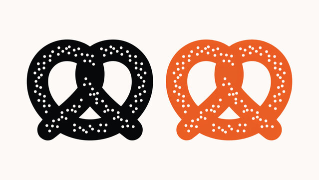 Pretzels in black and orange colors with white salt grains