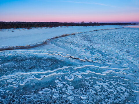 Ice toros on the Baltic Sea beach in Mikoszewo at sunrise. Poland