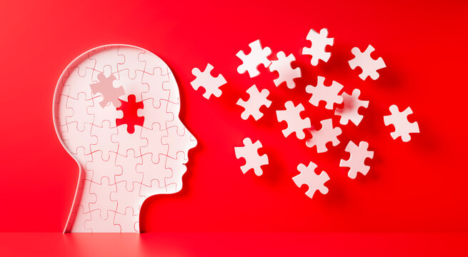 Conceptual artwork showing a 3D silhouette of a head surrounded by group of puzzle pieces, symbolizing mental input, activity, intelligence, or creativity - 3D illustration on red background