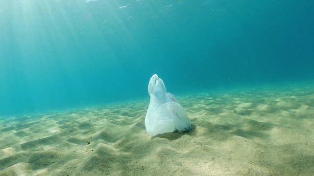 Bag in underwater, Environmental pollution problem plastic bottle in sea, Plastic rubbish garbage pollution in ocean, Plastic Bag floating underwater in Mediterranean sea, Plastic ocean pollution.