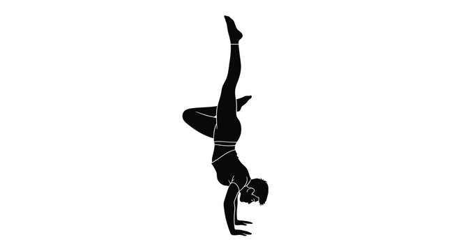 woman performing yoga pose in silhouette