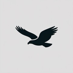 Fototapeta premium Minimalist black silhouette of an eagle flying isolated on grey background.