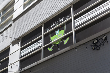 Fototapeta premium exterior building side and sign of Par-Tee Putt and Pong a bar located at 26 Duncan St, Toronto