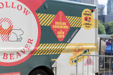 Naklejka premium dessert truck of BeaverTails (also known in French as Queues de Castor), the Canadian dessert brand, at a sporting celebration at Nathan Phillips Square, Toronto