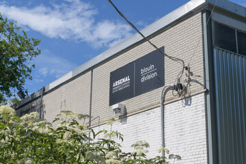 Naklejka premium exterior building facades with tarp sign of Arsenal Blouin Division, a contemporary art venue, located at 45 Ernest Av, Toronto (near West Toronto Rail Path)