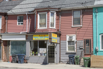 Naklejka premium exterior building facades and sign of Buddha’s Vegan Restaurant located at 666 Dundas St W, Toronto