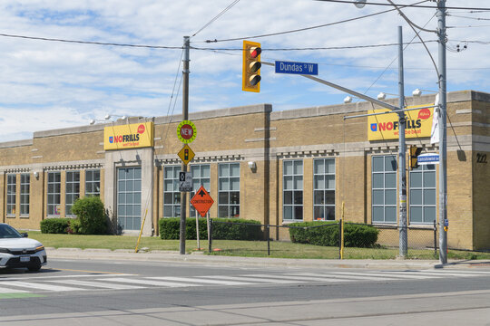 wide view of Mike's NOFRILLS, a grocery store, located here at 222 Lansdowne Av, south of Dundas St W, in a former cash register manufacturing plant, Toronto