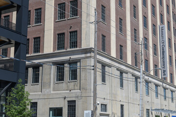 Fototapeta premium exterior historic building facade and sign of MOCA (Museum of Contemporary Art), 158 Sterling Rd, Toronto (Tower Automotive Building in the Junction Triangle)