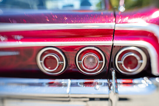 Close-up of triple chrome tail lights on a classic Chevrolet Impala,  November 2025.