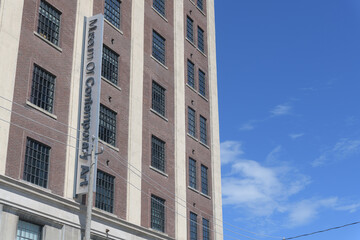 Fototapeta premium exterior historic building facade and sign of MOCA (Museum of Contemporary Art), 158 Sterling Rd, Toronto (Tower Automotive Building in the Junction Triangle)