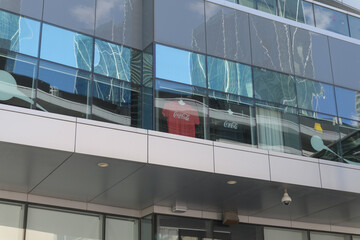 Fototapeta premium building with windows and t-shirts with Coca-Cola branding near Maple Leaf Square, Toronto