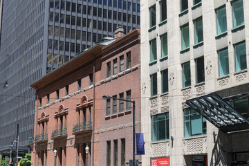 Naklejka premium looking north, east side to (l to r) TD Centre office complex building, historic The Toronto Club (107 Wellington St W/York St corner) and detail of art deco Prudential House, Toronto