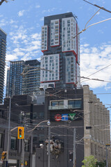 Fototapeta premium historic building of CTV television studio at Bell Media Headquarters at 299 Queen St W with towering Picasso Condominiums, Toronto