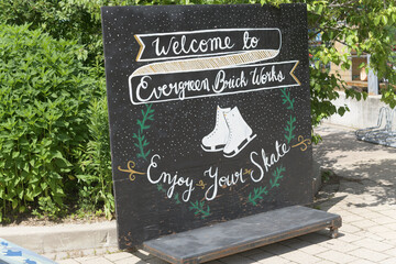 Fototapeta premium Welcome to Evergreen Brick Works skating sign in Spring (Toronto)
