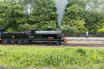 Obraz premium commuting on a steam train in Lancashire, England 