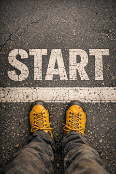 Sneakers with yellow soles at start of race or activity.