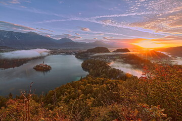 Colorful misty sunrise over the lake (Blejsko Jezero), the Assumption of Mary church and the castle, seen from Mala Osojnica hill. Bled-Slovenia-074