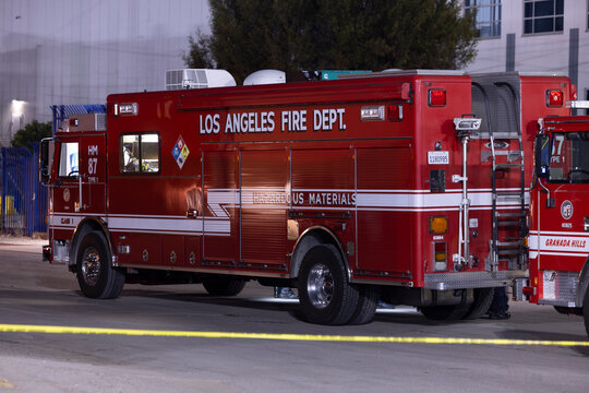 Los Angeles, California, USA - June 18, 2026: A Hazardous Materials Firefighter unit arrives on scene to secure the fire at the cold storage facilty.