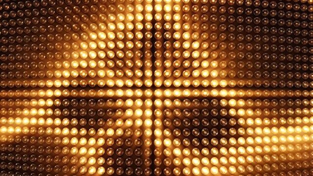 A wall of bright golden lights shines in a dazzling display.