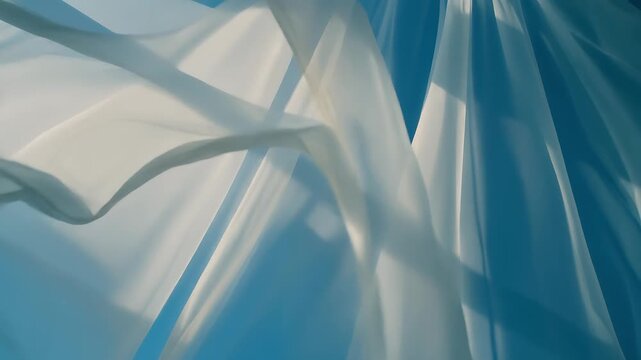 White sheer curtain blowing gently in the wind against clear blue sky with window frame shadows, concept of tranquil morning atmosphere and fresh air