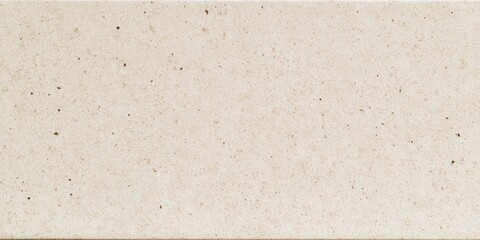 Fototapeta premium Surface made of light-colored stone with small dark specks in a clean and uniform pattern for building projects and design