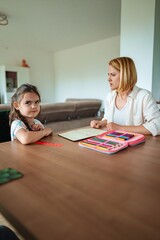 Fototapeta premium Engaging conversation between a child and adult at home