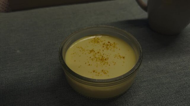 Creamy Creme Brulee Dessert In Glass Bowl With Caramelized Sugar Topping. Sweet French Custard Pudding