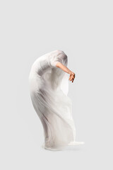 Human form in flowing white fabric, graceful movement and ethereal beauty, isolated on a clean...