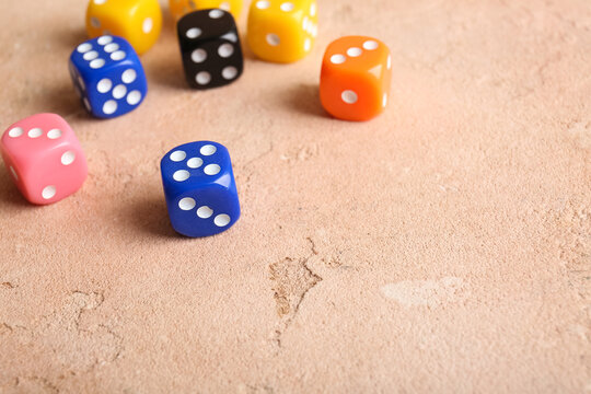 Different dices on beige background