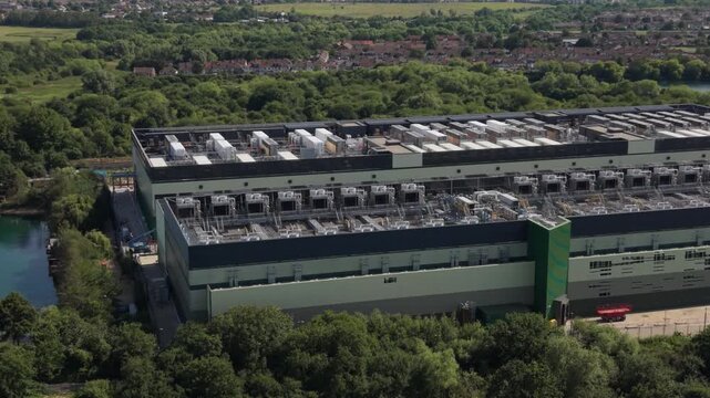 Massive Data Center Building by Water and Trees