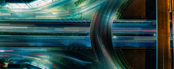 Abstract urban mobility background showing fast moving traffic and modern city roads designed for technology marketing, future transportation, sustainable infrastructure, and finance concepts. © Hand Robot