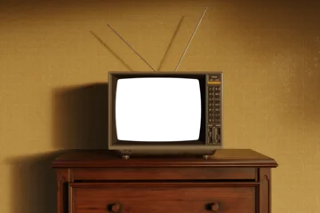 3D Rendering of an old television with isolated PNG screen in front of retro beige wall © Brilliant Eye
