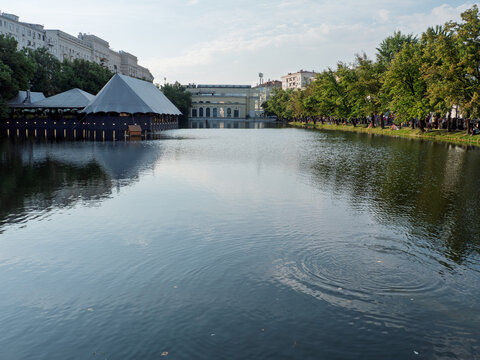 Peaceful Reflections on the Clear Pond in Moscow