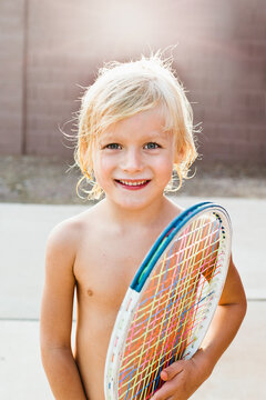 Blond Toddler Boy Holding Tennis Racket