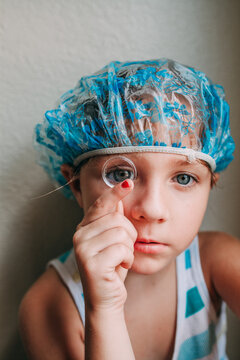 portrait of a little girl in shower cap