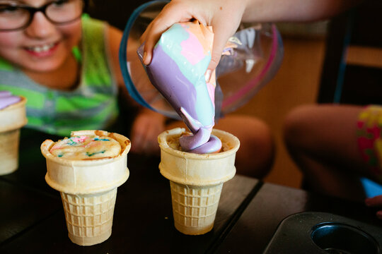 girls filling ice cream cones