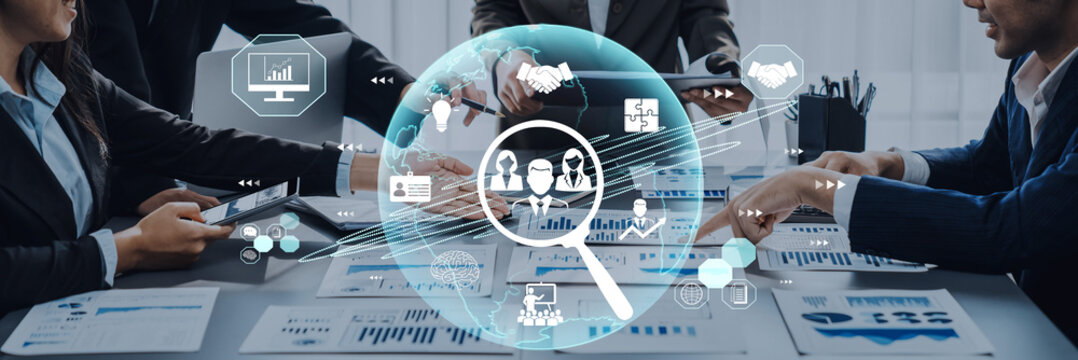 Business Team Collaborating on Data Analysis and Strategy Planning with Digital Magnifying Glass Icons Representing Various Insights and Graphs Fluxor.