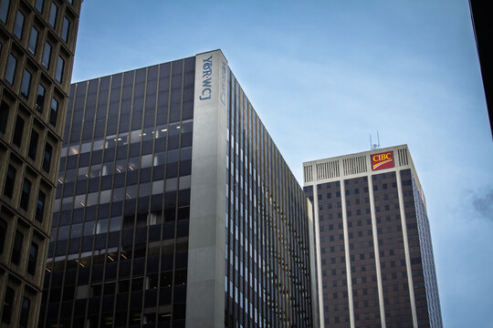 TORONTO, CANADA - DECEMBER 20, 2016: Y&R, WCJ and CIBC logos appear on office towers in downtown Toronto, showing advertising, banking and corporate signage.