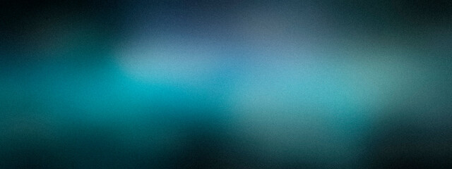Obraz premium A deep teal and blue abstract blur with drifting light streaks and soft vignetting, creating a moody atmosphere for cinematic backdrops and editorial layouts.