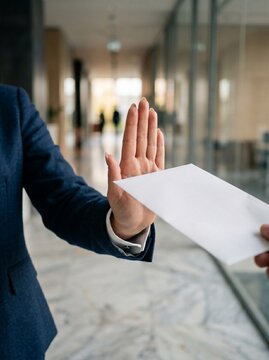 Business Professional Hand Gesture Refusing White Envelope Representing Anti Bribery And Corporate Integrity