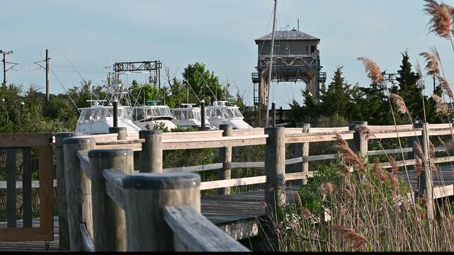 Mystic, Connecticut, USA - Mystic River Train Bridge Turning Above Harbor Boats