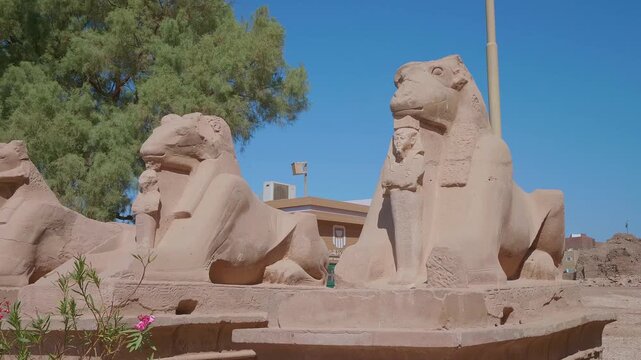 A captivating view of the ancient ram headed sphinx statues lining the sacred Avenue of Sphinxes at the Karnak Temple Complex in Luxor, Egypt.
