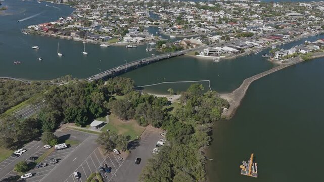 Cars Driving Through Oxley Drive Bridge From Hope Island To Paradise Point In Gold Coast, QLD, Australia. - aerial shot