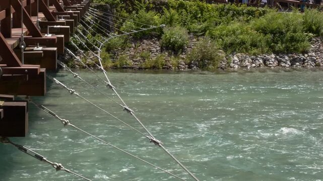 Wooden Structure And Support Cables Of Kappa Bridge Across Flowing Azusa River In Kamikochi, Nagano, Japan. static shot