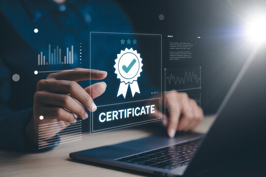 Business professional using modern laptop with holographic certification seal interface for quality assurance and compliance.