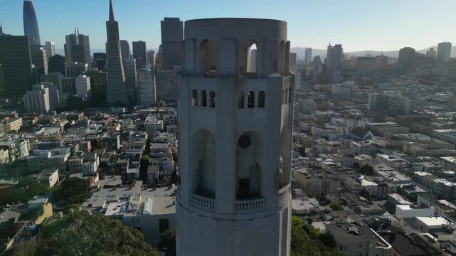 Cinematic drone footage orbiting around Coit Tower on Telegraph Hill in San Francisco. Smooth aerial movement showcasing the iconic Art Deco landmark.