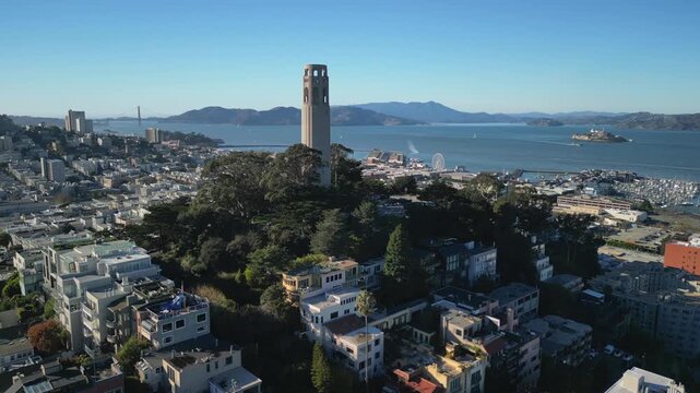 Cinematic drone footage orbiting around Coit Tower on Telegraph Hill in San Francisco. Smooth aerial movement showcasing the iconic Art Deco landmark.