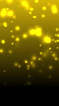 Abstract golden bokeh lights floating on dark yellow and black gradient background. Magical glowing particles overlay effect for festive luxury celebration, Christmas holiday, vertical video template
