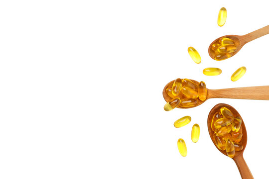 Spoons display vibrant fish oil capsules promoting nutrition, PNG